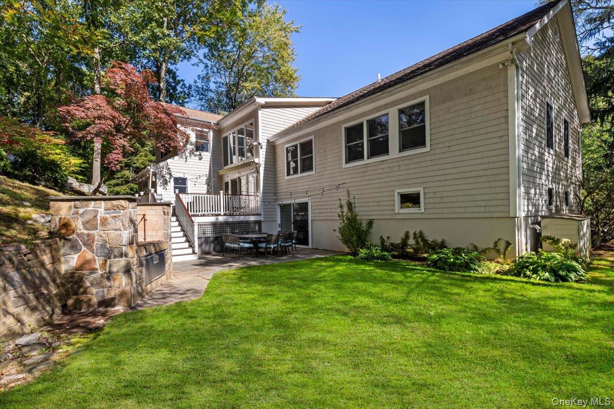14 Eagles Bluff Rye Brook, NY 10573 - Photo 38 of 48 Best of both worlds, backyard has flat leveled grass area and stone patio, all surrounded by a beautifully terraced, natural landscape that provides exceptional privacy and a peaceful, retreat-like setting.