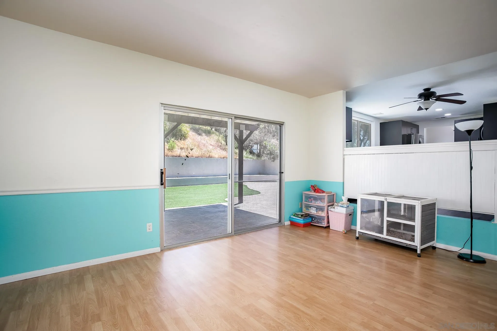 9229 Birchcrest Boulevard Santee, CA 92071 - Photo 18 of 39 a view of a room with wooden floor fireplace and windows