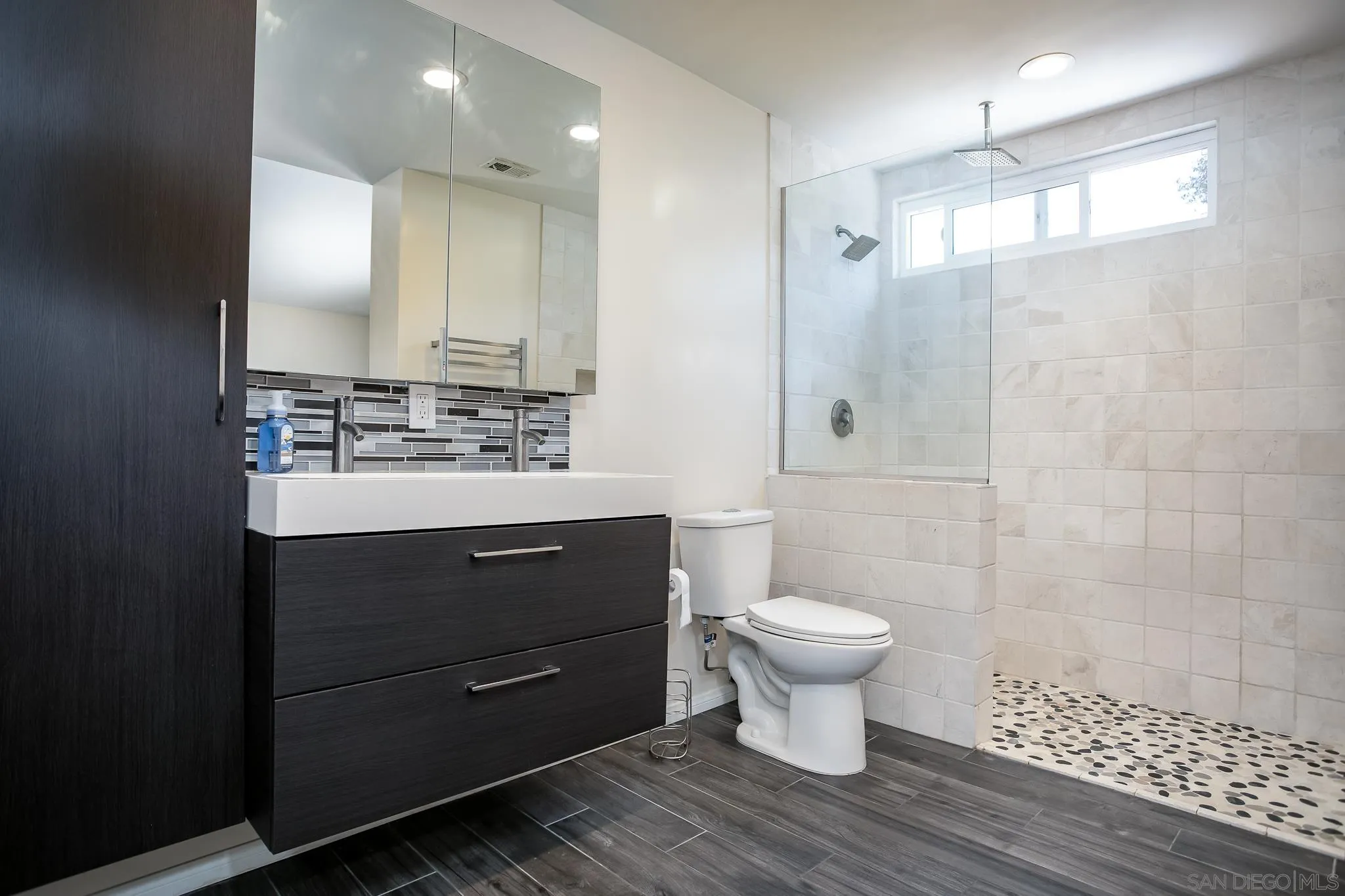 9229 Birchcrest Boulevard Santee, CA 92071 - Photo 25 of 39 a bathroom with a sink toilet and shower