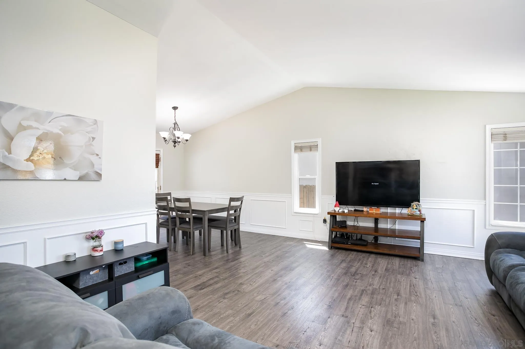 9229 Birchcrest Boulevard Santee, CA 92071 - Photo 8 of 39 a living room with furniture and a flat screen tv