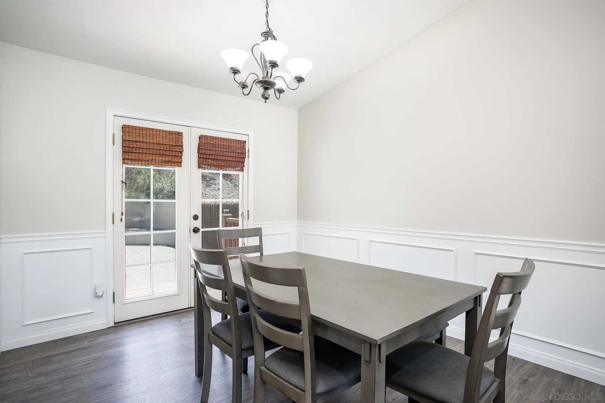 9229 Birchcrest Boulevard Santee, CA 92071 - Photo 10 of 39 a view of a dining room with furniture wooden floor and chandelier