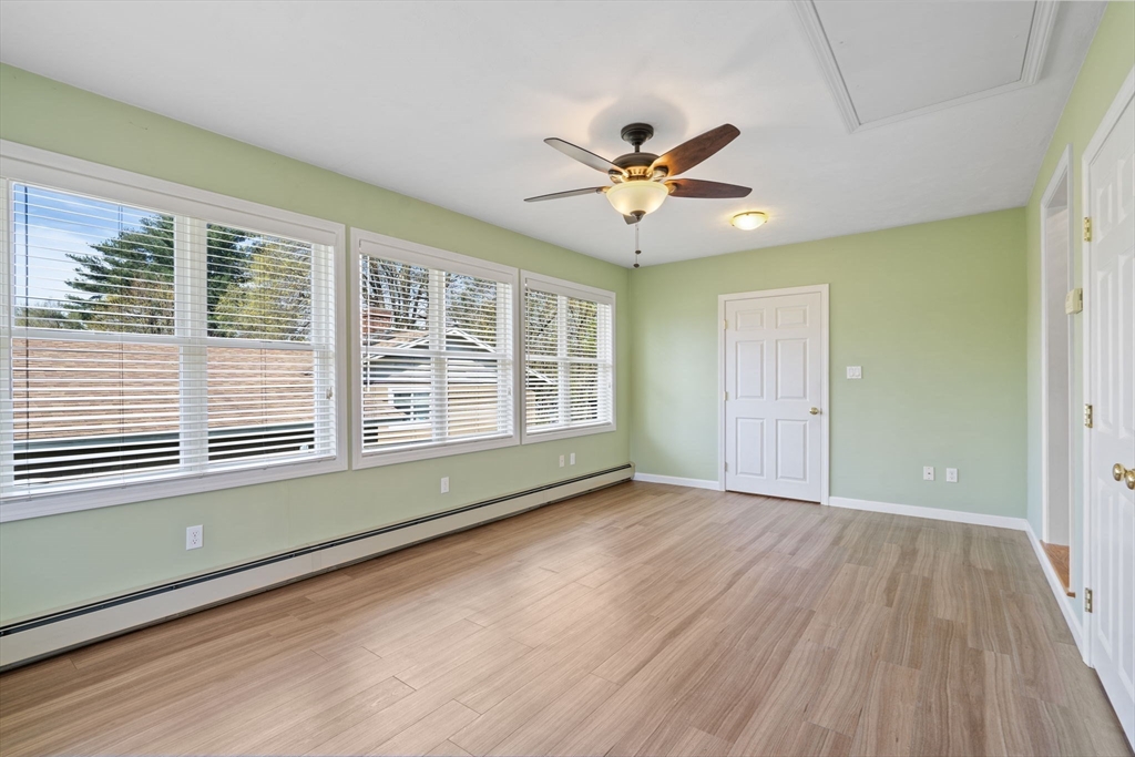 3 Ruth Drive Framingham, MA 01701 - Photo 13 of 35 a view of an empty room with a window and wooden floor