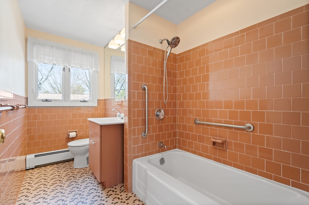 3 Ruth Drive Framingham, MA 01701 - Photo 22 of 35 a bathroom with a bathtub a toilet a sink and a shower