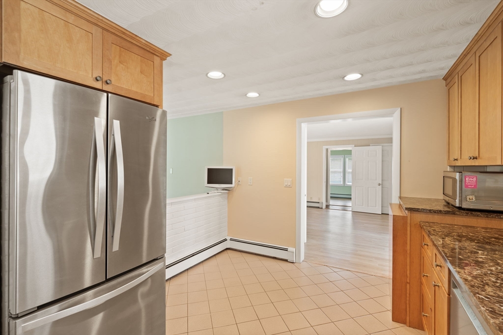 3 Ruth Drive Framingham, MA 01701 - Photo 6 of 35 a kitchen with stainless steel appliances a refrigerator and a stove top oven