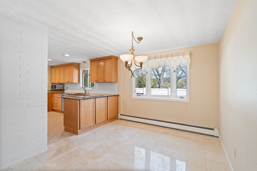 3 Ruth Drive Framingham, MA 01701 - Photo 7 of 35 a view of a kitchen with a sink and a window