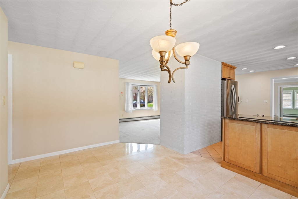 3 Ruth Drive Framingham, MA 01701 - Photo 8 of 35 a view of a room with a chandelier