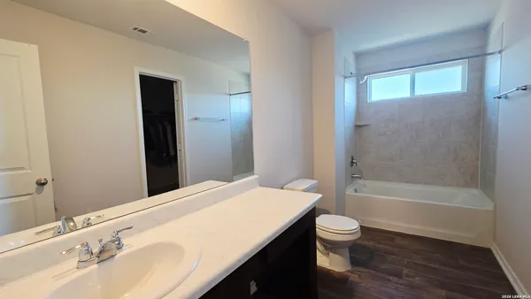 an empty room with a empty space and windows