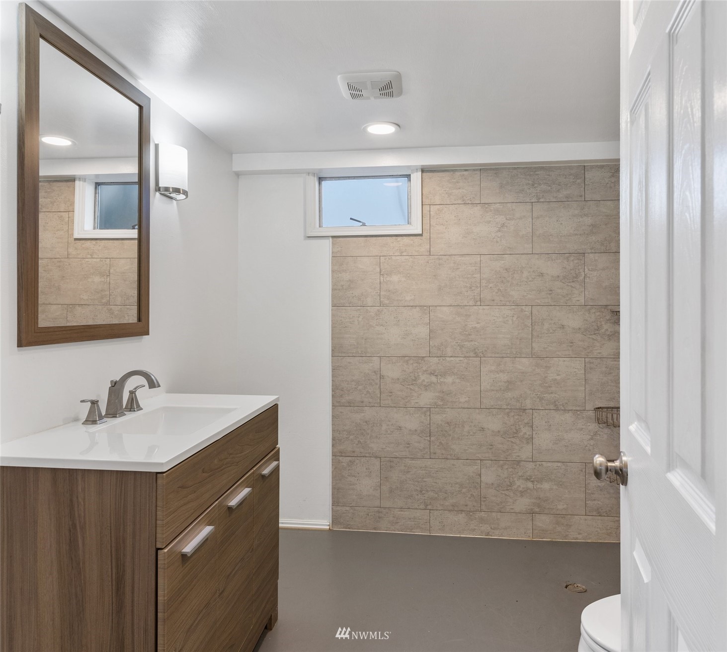 2309 Northeast 9th Street Renton, WA 98056 - Photo 18 of 22 a bathroom with a sink and a mirror