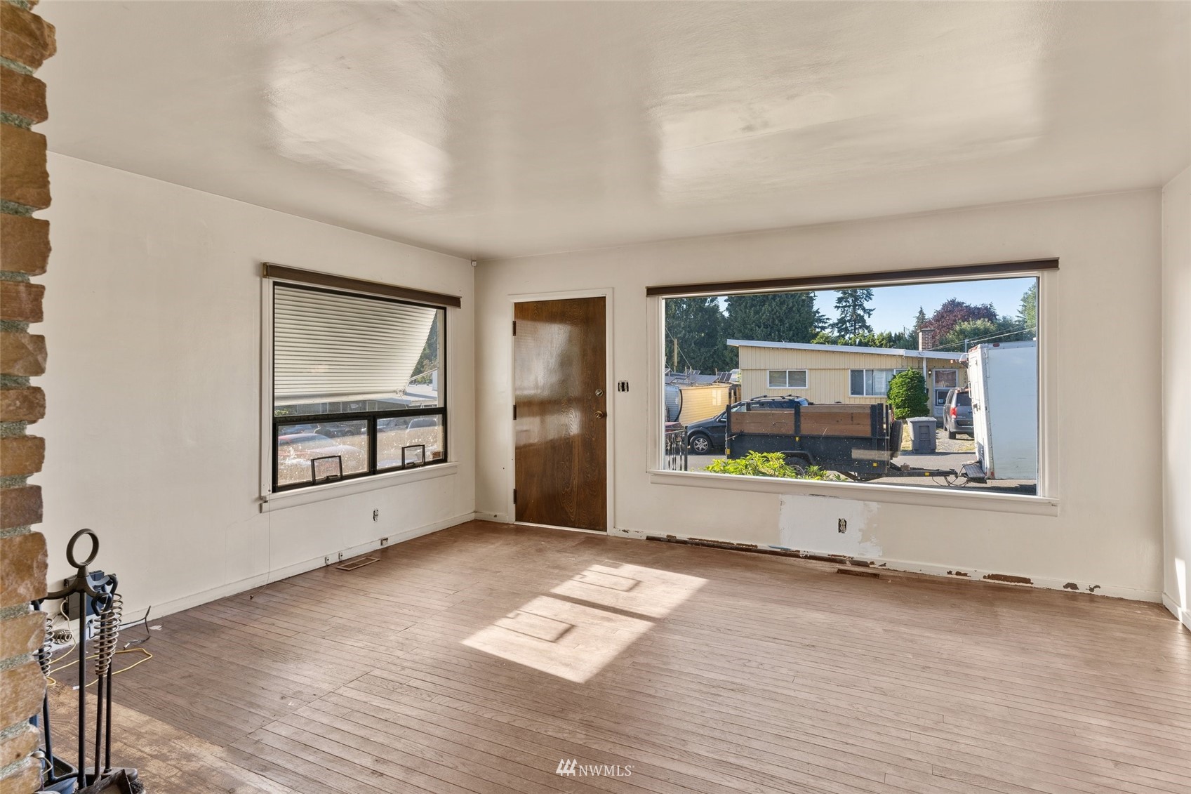 2309 Northeast 9th Street Renton, WA 98056 - Photo 4 of 22 wooden floor in an empty room with a window