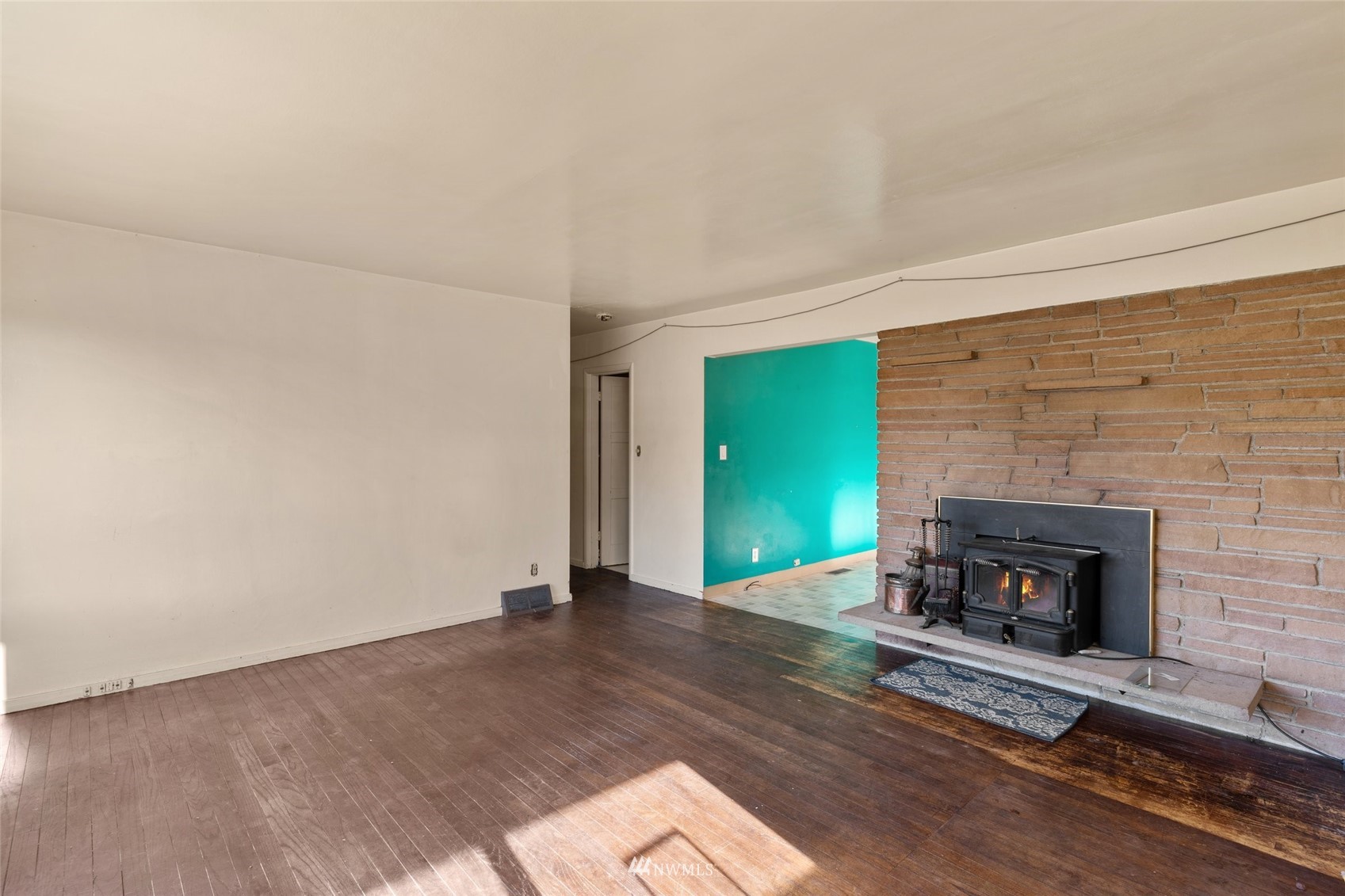 2309 Northeast 9th Street Renton, WA 98056 - Photo 6 of 22 a view of an empty room with a fireplace
