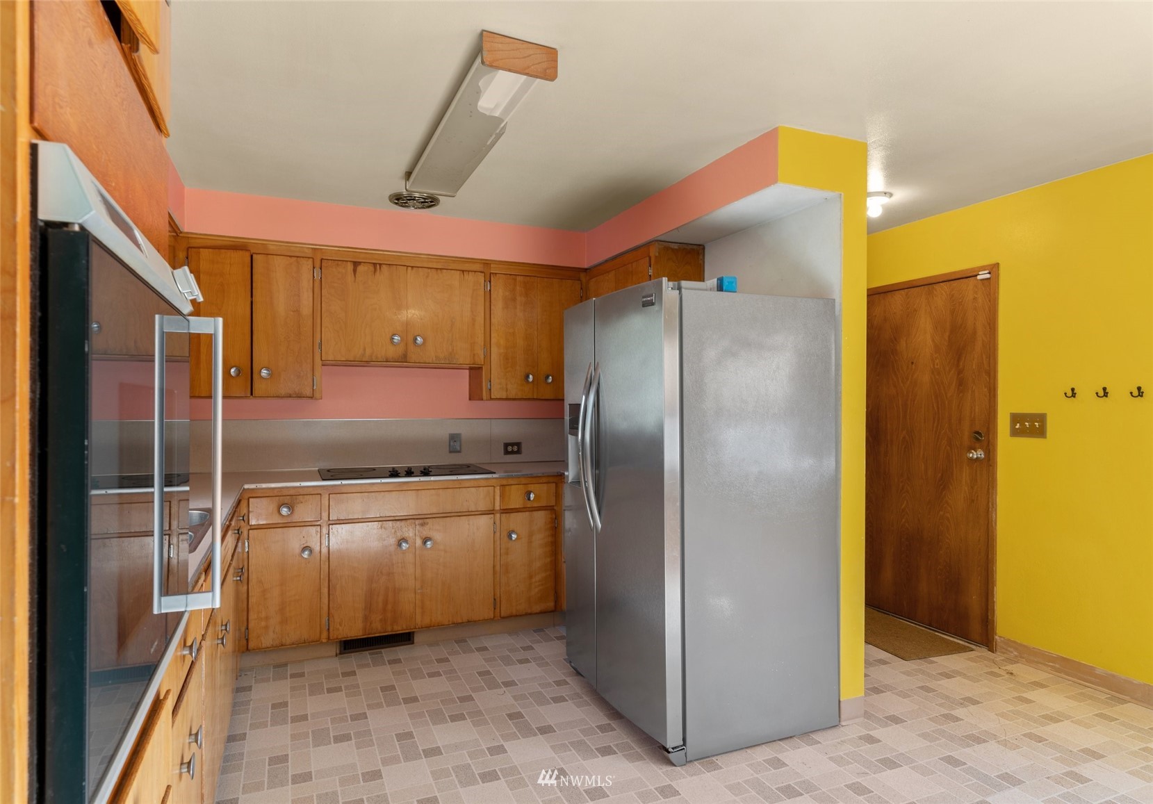 2309 Northeast 9th Street Renton, WA 98056 - Photo 9 of 22 a kitchen with stainless steel appliances granite countertop a refrigerator a sink and a stove