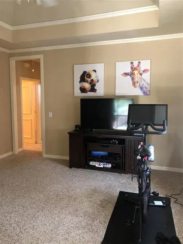 a room with furniture and a flat screen tv