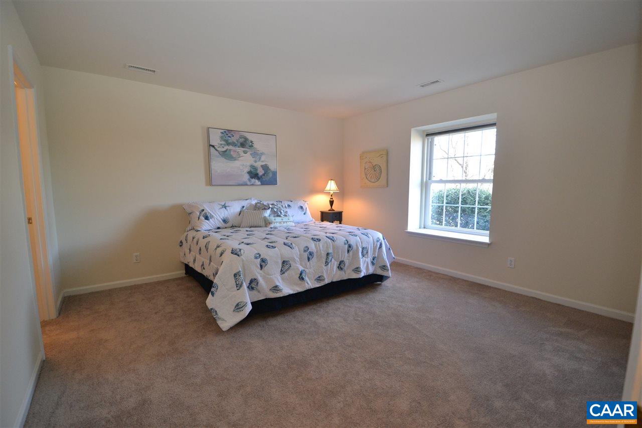 4757 Clover Ridge Court Charlottesville, VA 22901 - Photo 11 of 18 a bed sitting in a bedroom next to a window