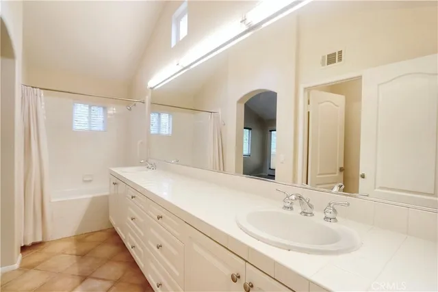a bathroom with a granite countertop sink mirror and a