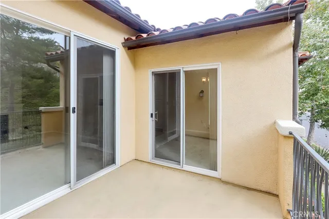a balcony with an outdoor space