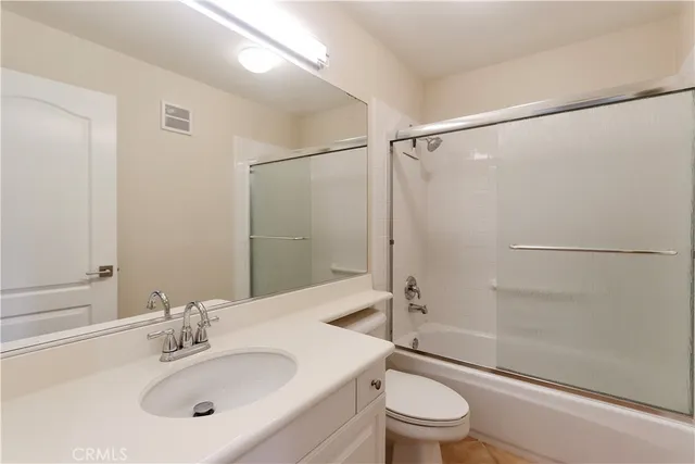 a view of a big room with furniture and a chandelier