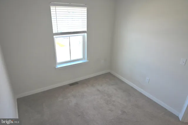 a bathroom with a tub sink vanity and toilet