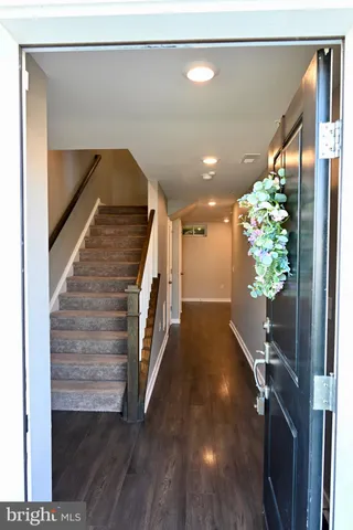a view of entryway with wooden floor