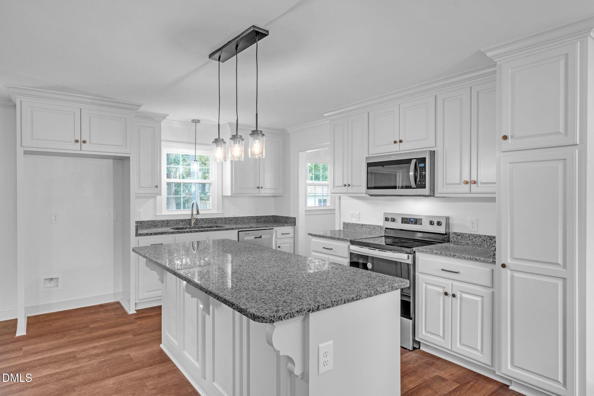 1219 Queen Anne Road Northwest Wilson, NC 27896 - Photo 23 of 26 a kitchen with stainless steel appliances granite countertop a sink stove and refrigerator