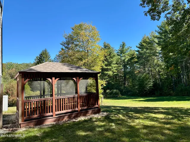 a view of a roof deck with two chair and a table