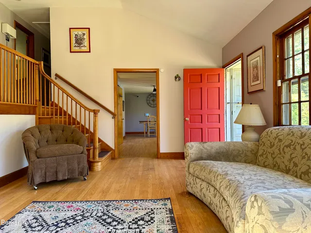 a living room with furniture and a rug