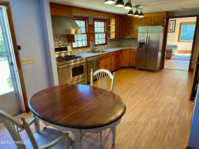 a view of a kitchen with furniture and window