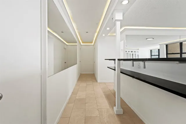 a hallway with cabinets