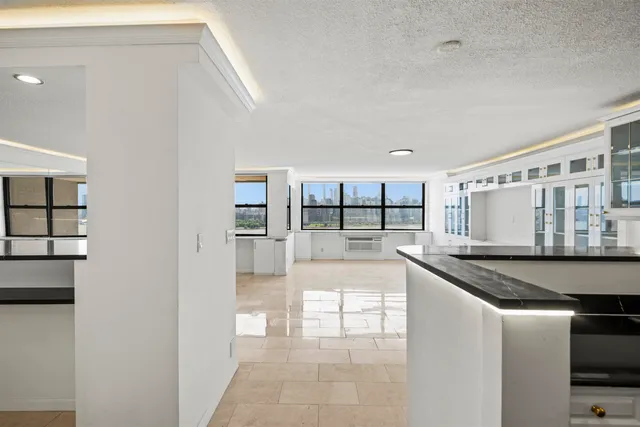 a kitchen with stainless steel appliances granite countertop a sink and a stove