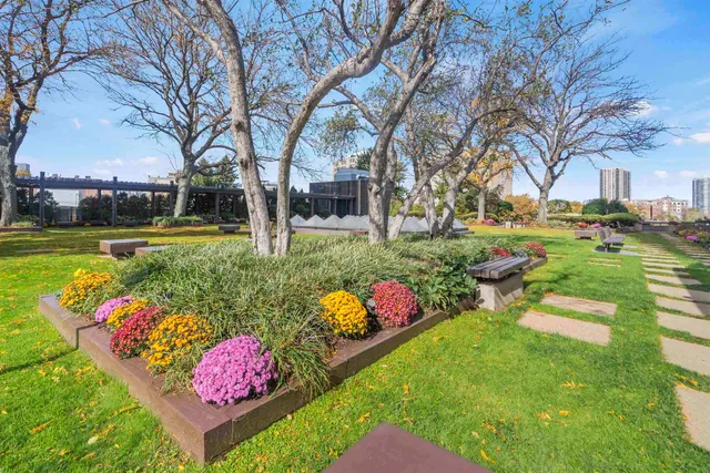 a view of a swimming pool yard and patio
