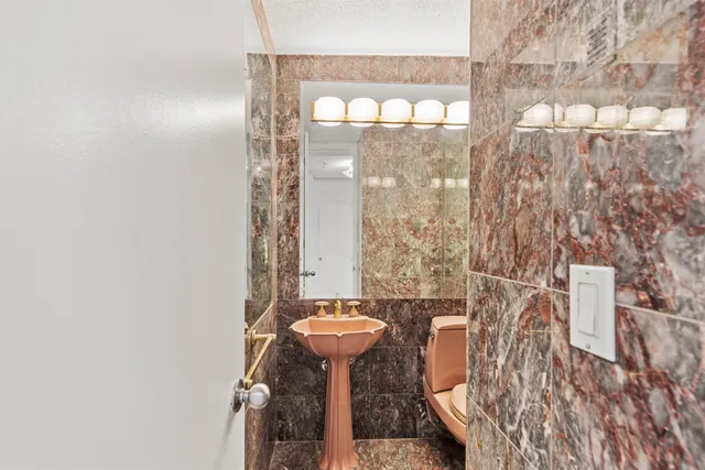 a bathroom with a shower curtain and a sink