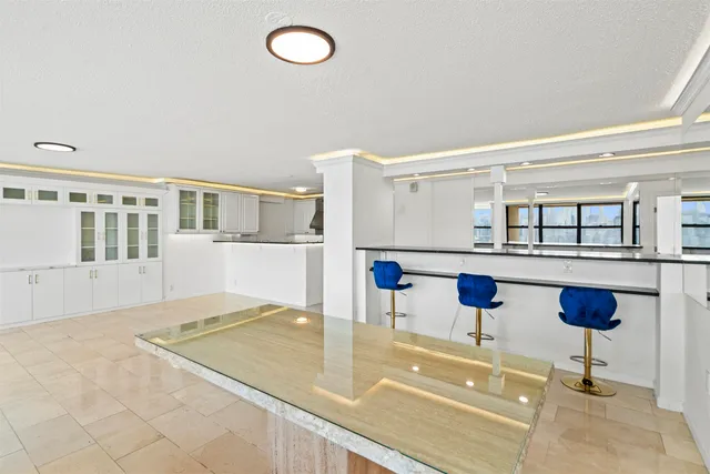 a view of kitchen and hall with wooden floor