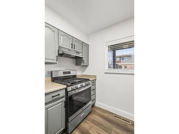 a kitchen with a stove and a microwave