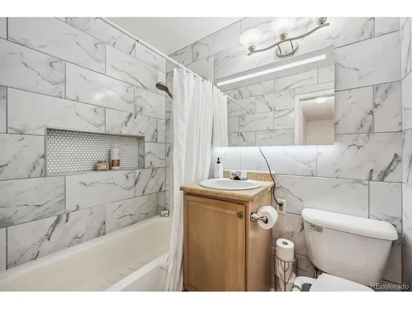a bathroom with a bathtub and a sink