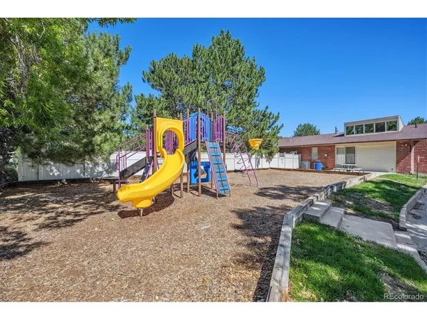 a view of a house with swimming pool and sitting area