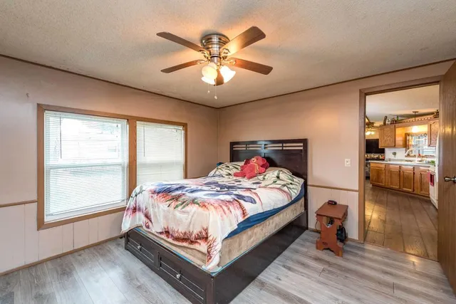 a bedroom with a bed and window