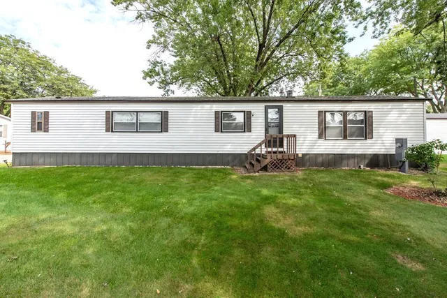 a backyard of a house with seating space