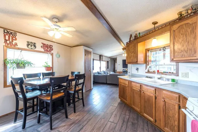 a large kitchen with a table and chairs