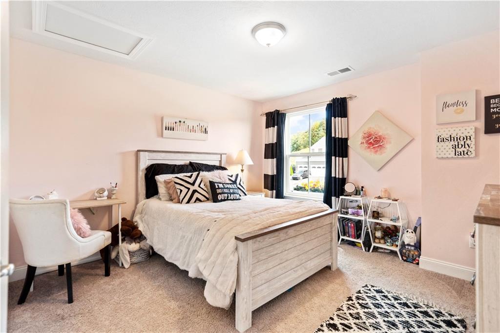 7660 Dominick Drive Irwin, PA 15642 - Photo 16 of 25 a bedroom with a bed and a table