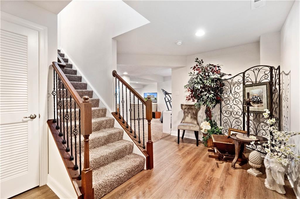 7660 Dominick Drive Irwin, PA 15642 - Photo 17 of 25 wooden floor with windows and stairs