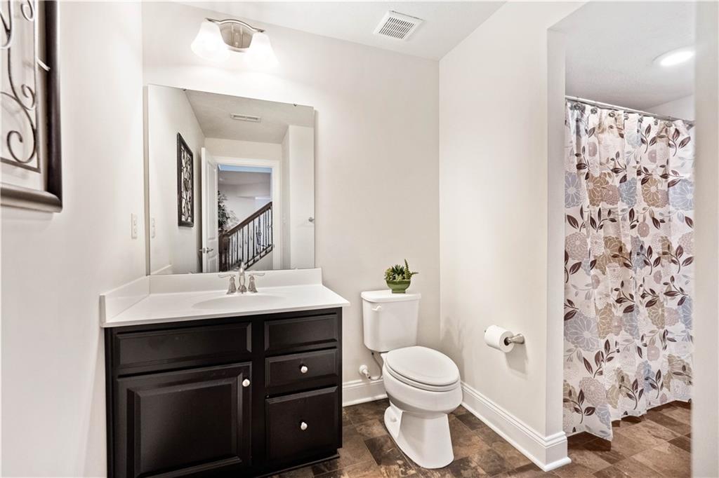 7660 Dominick Drive Irwin, PA 15642 - Photo 21 of 25 a bathroom with a toilet sink and mirror