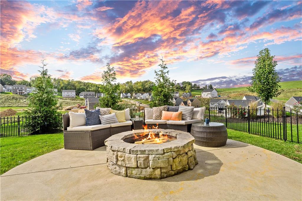 7660 Dominick Drive Irwin, PA 15642 - Photo 23 of 25 a view of a patio with couches chairs and a fire pit