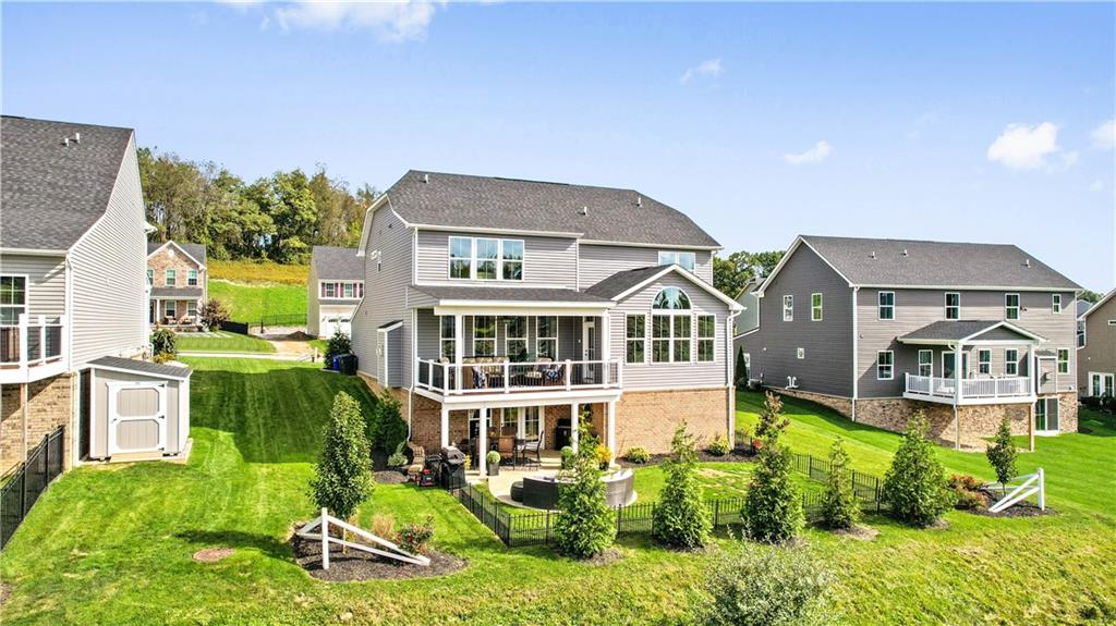 7660 Dominick Drive Irwin, PA 15642 - Photo 24 of 25 a aerial view of a house with a yard and potted plants