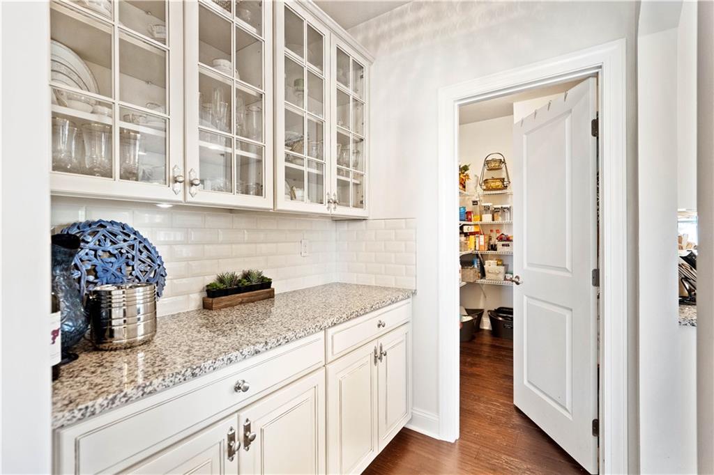 7660 Dominick Drive Irwin, PA 15642 - Photo 7 of 25 a kitchen with granite countertop a sink and a refrigerator
