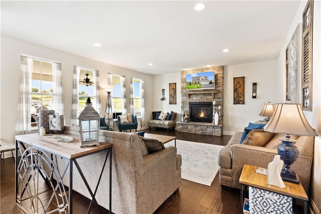 7660 Dominick Drive Irwin, PA 15642 - Photo 8 of 25 a living room with fireplace furniture and a flat screen tv