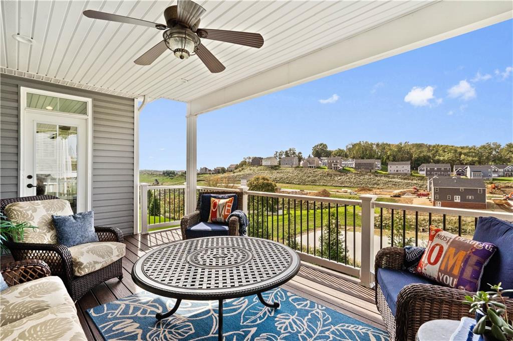 7660 Dominick Drive Irwin, PA 15642 - Photo 10 of 25 a living room with furniture a rug and a chandelier