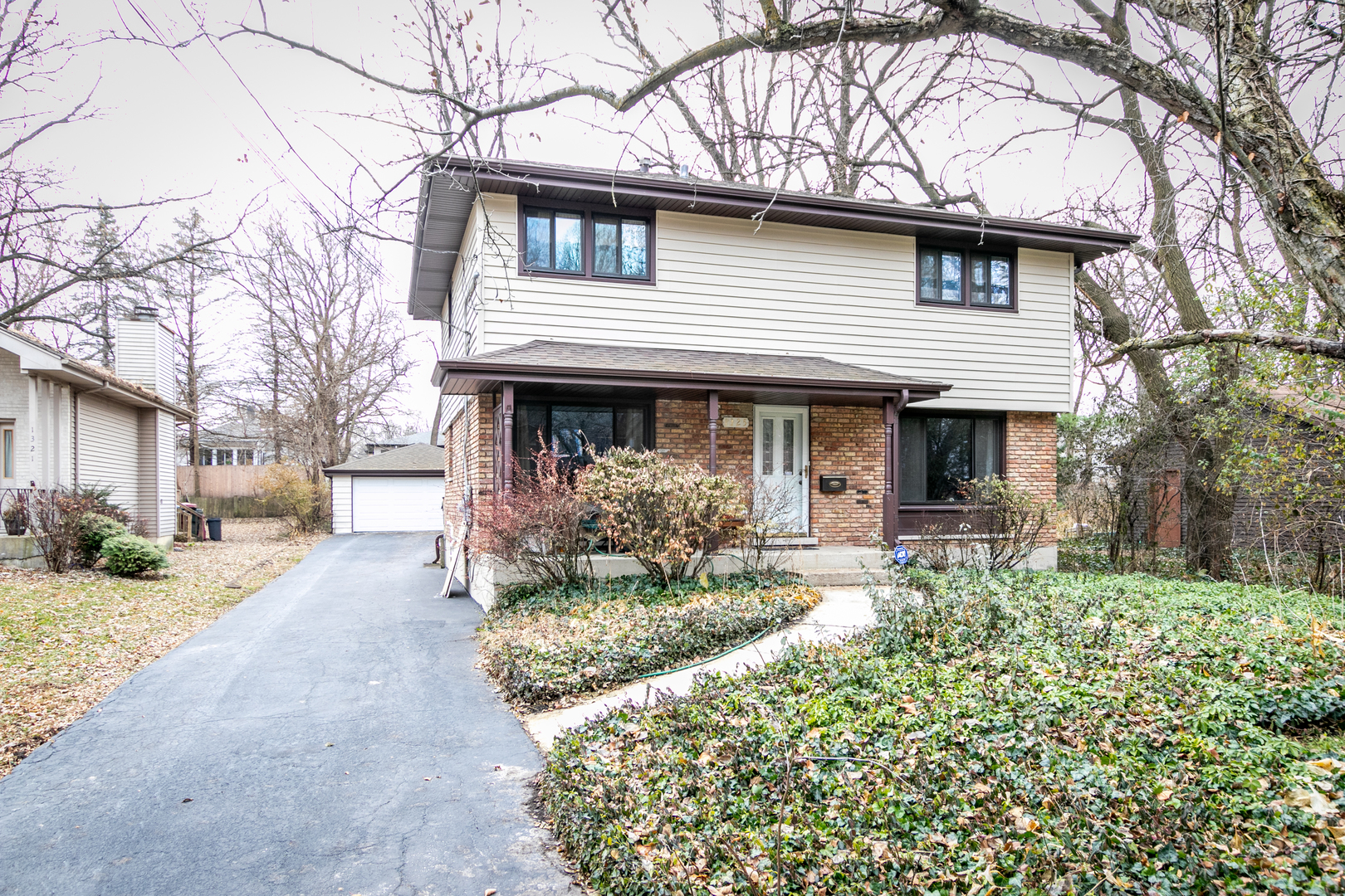 1325 Linden Road Homewood, IL 60430 - Photo 2 of 19 a front view of a house with a yard and porch