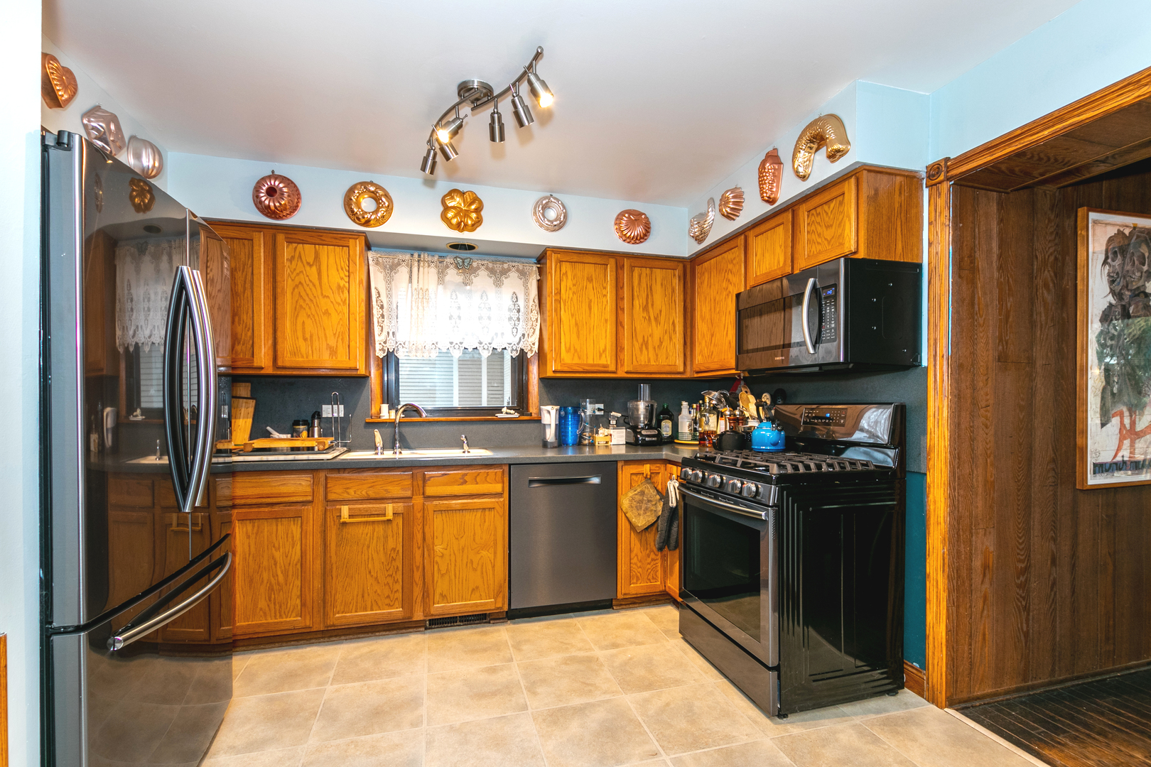 1325 Linden Road Homewood, IL 60430 - Photo 8 of 19 a kitchen with stainless steel appliances granite countertop a stove a sink dishwasher and a refrigerator