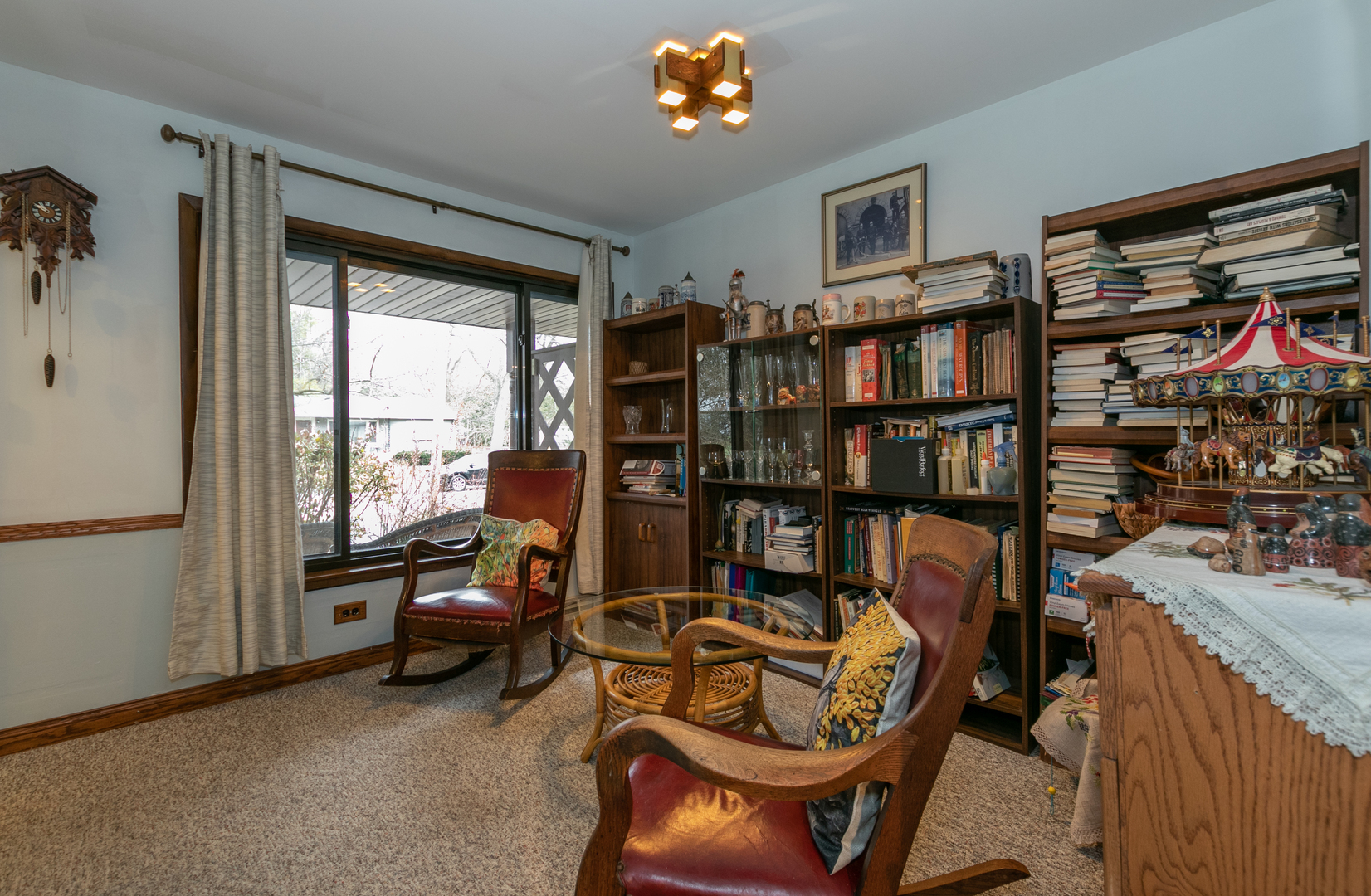 1325 Linden Road Homewood, IL 60430 - Photo 10 of 19 a living room with furniture a bookshelf and a window