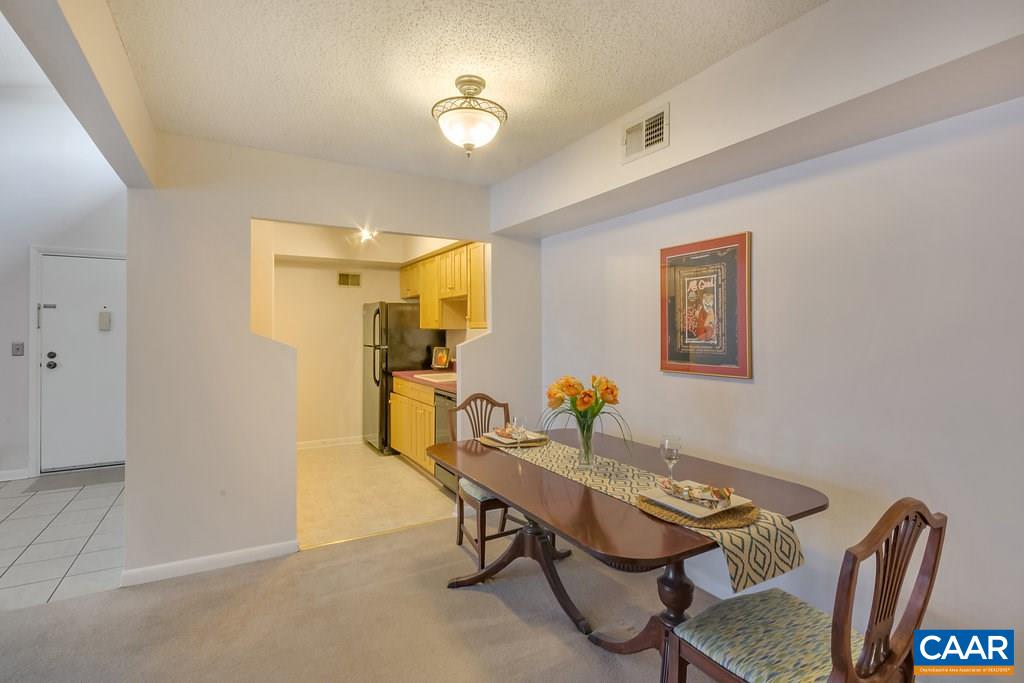 101 Turtle Creek Road, Unit 12 Charlottesville, VA 22901 - Photo 11 of 36 a workspace with furniture and chandelier
