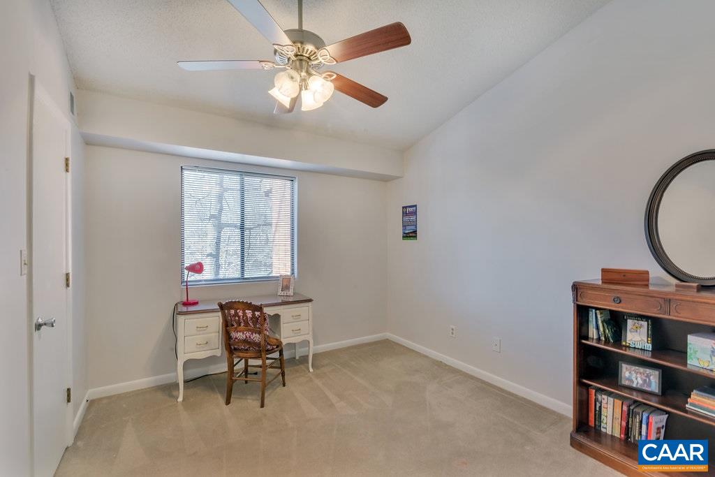 101 Turtle Creek Road, Unit 12 Charlottesville, VA 22901 - Photo 17 of 36 wooden floor with a window and a kitchen